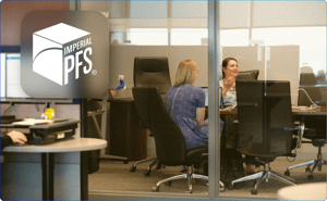 An image of the Imperial PFS office interior with several employees speaking at a conference table. The IPFS logo is over the image at the top left.
